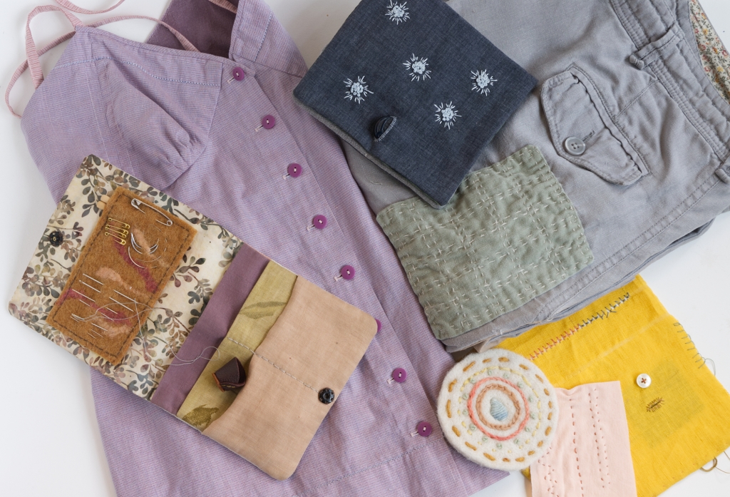 A grouping of mending and stitching projects including clothing, samples, and sewing kits.